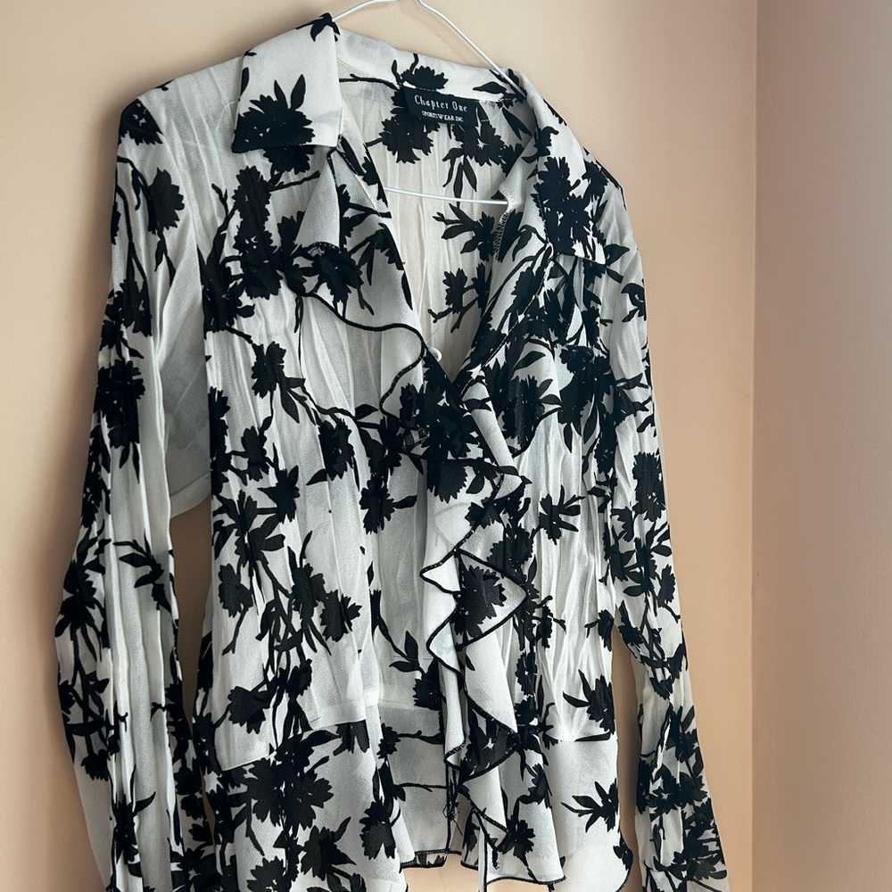 Pleated/wrinkled black and white blouse with unique ruffles.